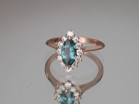 Saturday Sparkle!! 20% OFF retirement SALE!! Marquise teal sapphire mounted in a rose gold diamond cluster! #uniqueengagement #tealsapphire #peacocksapphire #bluegreensapphire #tealengagement #peacockengagement #jewelry #rosegold #marquise #ring #jewellery #bling #rings #jewels #instajewelry #jewelrygram #engagementring #jewel #sapphire #weddingring #finejewelry  #jewelryaddict #weddingrings #jewelrylover #💍 #weddingband #jewelrysale #gemstonejewelry #marquiseengagement Blue Green Sapphire Ring, Oval Sapphire Engagement Ring, Green Sapphire Ring, Oval Cut Engagement Ring, Blue Green Sapphires, Engagement Rings Affordable, Sapphire Rings, Unique Diamond Rings, Rose Gold Diamond Ring