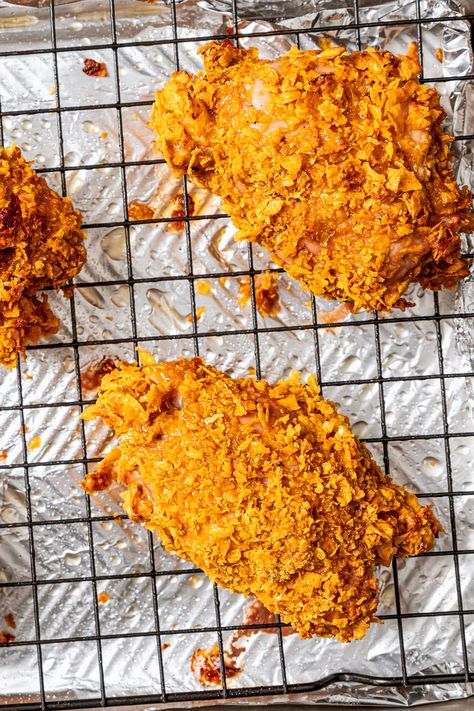 The whole family is going to love this easy cornflake chicken! Tender chicken thighs are coated in simply seasoned crushed cornflakes and baked to crunchy on the outside and juicy on the inside. Cornflake Ranch Chicken, Cornflake Chicken Baked, Cornflake Chicken Breast, Cornflake Crusted Chicken, Baked Chicken And Mushrooms, Cornflake Chicken, Oven Baked Chicken Thighs, Chicken And Mushrooms, Crunchy Chicken