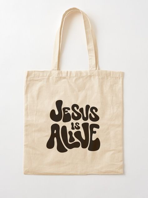 "Jesus is Alive (Black)" Tote Bag for Sale by PraiseandGlory | Redbubble Eco Bag Design Ideas, Christian Tote Bag Design, Jesus Tote Bag, Tote Bag Ideas, Decorated Tote Bags, Tote Bag Christian, Tote Bag Designs, Handpainted Tote Bags, Crochet Sweater Design