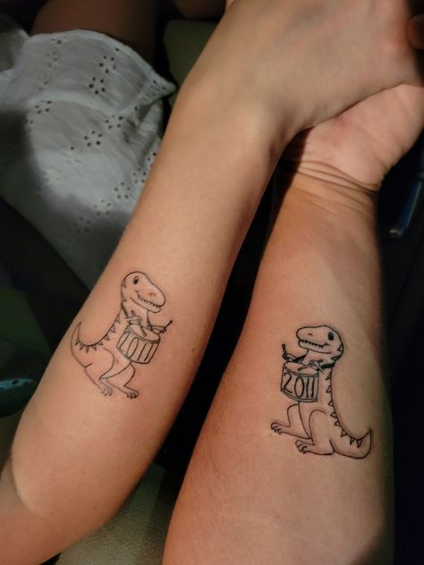 T-rex playing a drum. 10 year Anniversary present. 10 Year Anniversary Tattoo, Anniversary Tattoo, Couple Tattoo, 10 Year Anniversary, Anniversary Present, Couple Tattoos, Year Anniversary, T Rex, Geometric Tattoo