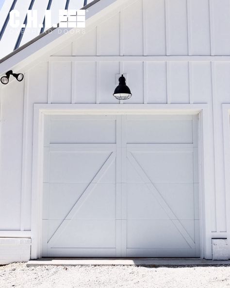 Which garage door styles would look best on your home? Here are 7 common architectural styles and our corresponding garage door recommendations. Source: @virginia.farmhouse.project on instagram. Farmhouse Garage Doors, Carriage Garage, Garage Door Lights, White Garage Doors, Barn Style Garage, White Garage, Carriage Garage Doors, What To Think About, Carriage House Garage