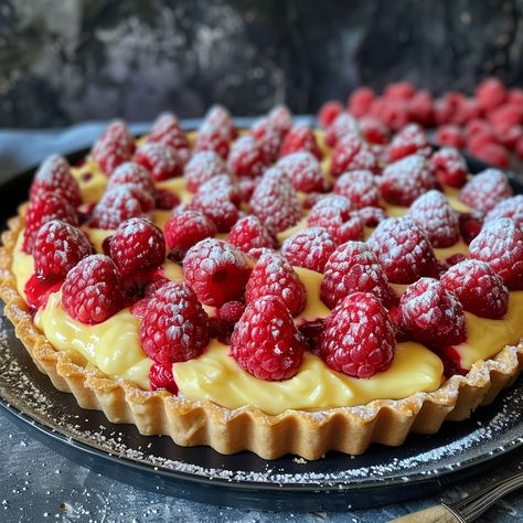 Tart-alicious! Tarte Citron Framboises (Lemon Raspberry Tart) Raspberry This recipe combines the sunshiney tartness of lemon with the sweet burst of raspberries for a delightful and refreshing dessert! ☀️ Ingredients: For the Pâte Sucrée (Sweet Pastry Crust): 200g all-purpose flour 80g powdered sugar 25g almond flour 1 cold egg 125g cold unsalted butter, cubed For the Lemon Cream Filling: 3 eggs 150g sugar 100ml freshly squeezed lemon juice (around 2 lemons) 75g unsalted butter, softened ... Raspberry Custard Tart Recipe, Lemon Raspberry Tart, Mini Lemon Raspberry Tarts, Pioneer Woman Lemon Raspberry Tarts, Raspberry Custard Tart, Lemon Tart With Raspberries, Fall Bakery, Lemon Cream Filling, Pie Weights