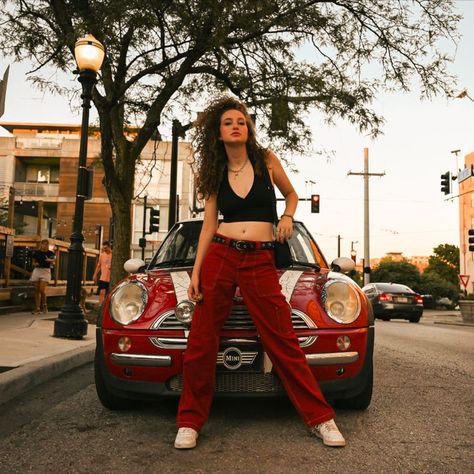 Edgy model standing in front of red mini cooper Mini Cooper Photoshoot, Red Aesthetic Car, Posing With Car, Edgy Pose, Girl Red Aesthetic, Edgy Photoshoot, Car Pose, Red Photoshoot, Red Mini Cooper