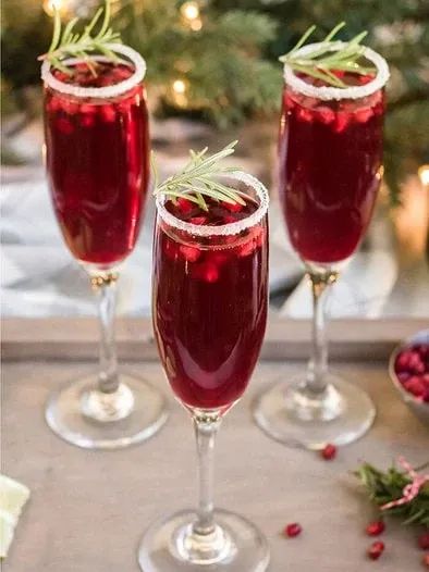 Holiday Pomegranate Mimosa. Give the classic mimosa a holiday twist with some pomegranate juice and rosemary sprigs. This drink is super easy to make — just mix some champagne, pomegranate juice, lime and sugar. Enjoy! Poinsettia Drink, Best Eggnog Recipe, Pomegranate Mimosa, Classic Mimosa, Pomegranate Drinks, Mimosa Drink, Holiday Cocktail Recipes, Easy Holiday Cocktails, Cranberry Mimosa