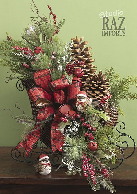 Sleigh arrangement. Christmas centerpiece and decorating ideas. Small Sleigh Decorating Ideas Christmas, Sleigh Floral Arrangements, Wicker Sleigh Christmas Decor, Christmas Sleigh Decorations, Christmas Centers, Centerpiece Christmas, Raz Imports, Christmas Flower Arrangements, Holiday Arrangement