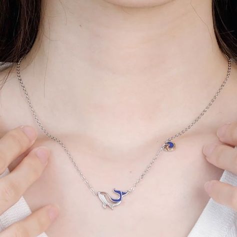 This elegant whale-themed silver necklace features a detailed whale pendant with blue and gold accents. Perfect for ocean lovers, it combines durability and style, making it an ideal gift. #Jewelry #WhaleLover #OceanThemed Whale Pendant Necklace, Whale Pendant, Ocean Lover, Gift Jewelry, Blue And Gold, Gold Accents, Ideal Gift, Silver Necklace, Pendant