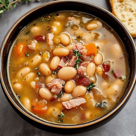 WHITE BEAN AND HAM HOCK SOUP White Bean And Ham Hock Soup Crock Pot, Hambone Soup Recipes, Ham And Beans Soup, Bean And Ham Hock Soup, White Bean And Ham Soup, White Bean And Ham, Ham Hock Soup, Bean And Ham Soup, Ham Hocks And Beans