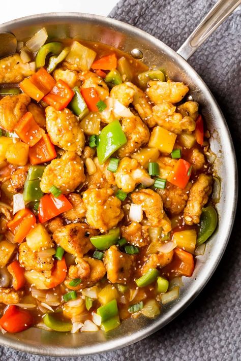 You won't miss take out with this healthy sweet and sour chicken. With crispy chicken, bell peppers, pineapple, and onion, it taste just like your favorite Chinese restaurant. All topped with a sweet and savory sauce you'll love! Paleo, Whole30, gluten free, and soy free too! #sweetandsourchicken #whole30chicken #paleo #glutenfree Mini Sweet Pepper Recipes Chicken, Healthy Sweet And Sour Chicken, Chicken Bell Peppers, Mini Peppers Recipes, Chicken Minis, Whole30 Chicken, Easy Skillet Meals, Sweet And Sour Chicken, Sweet Sour Chicken