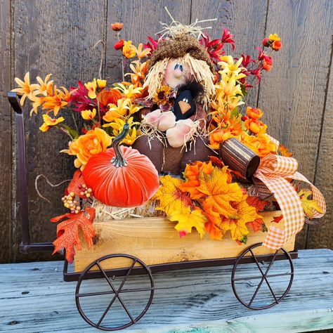 A scarecrow, fall leaves, and pumpkins. OH MY... This autumn arrangement is complete in a wagon ... ready to give autumn vibes to all your fall home decorations. This would be a great accent for your outdoor patio, front porch, or wherever you choose... Available Now-Ready to Ship #tinasdecomeshwreaths🍁🍂 Link in Bio Fall Wagon Decor, Autumn Front Porch, Fall Leaves And Pumpkins, Front Porch Decorations, Gingerbread Man Decorations, Spring Door Decoration, Fall Pumpkin Crafts, Harvest Decor, Porch Decorations