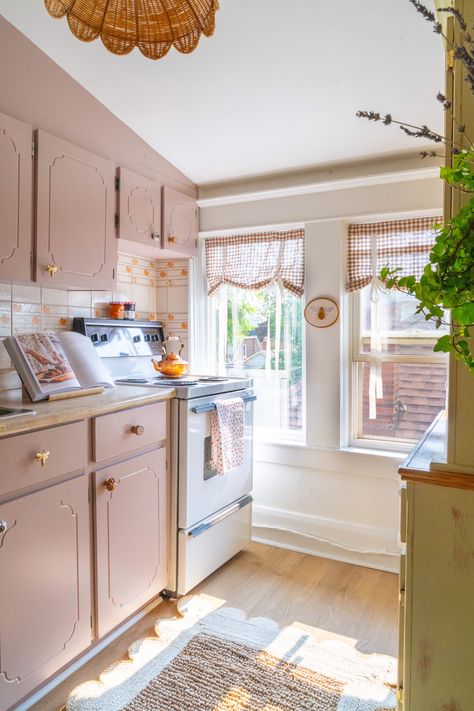 I totally made over this cottage-core kitchen! Curtains from @bicoestonia, paint on cabinets is Flax from @benjamin_moore, light fixture from @ivoryanddeene Alexandra Gater Kitchen, Light Pink Cabinets Kitchen, Pink Cottage Kitchen, Light Pink Cabinets, Light Pink Kitchen Cabinets, Pink Cabinets Kitchen, Light Pink Kitchen, Pink Kitchen Inspiration, Alexandra Gater