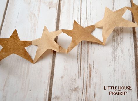 Make your very own paper stars like Mary and Laura did in "On the Banks of Plum Creek". #LittleHouseMoment Paperbag Stars, Jk Christmas, Diy Paper Hearts, Pioneer Christmas, Homemade Paper, Hearts And Stars, Star Banner, Kraft Paper Wrapping, Little House On The Prairie