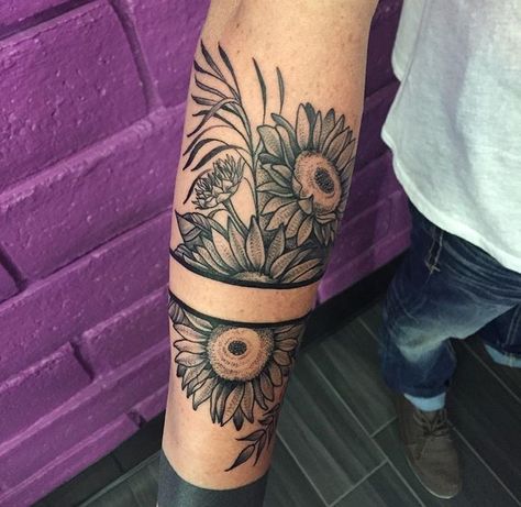 Sunflower tattoo Sunflower Wrap Around Tattoo Forearm, Sunflower Tattoo Men Arm, Sunflower Cuff Tattoo, Sunflower Arm Wrap Tattoo, Sunflower Arm Band Tattoo, Sunflower Tattoo Inside Arm, Masculine Sunflower Tattoo, Arm Cuff Tattoo, Black Band Tattoo