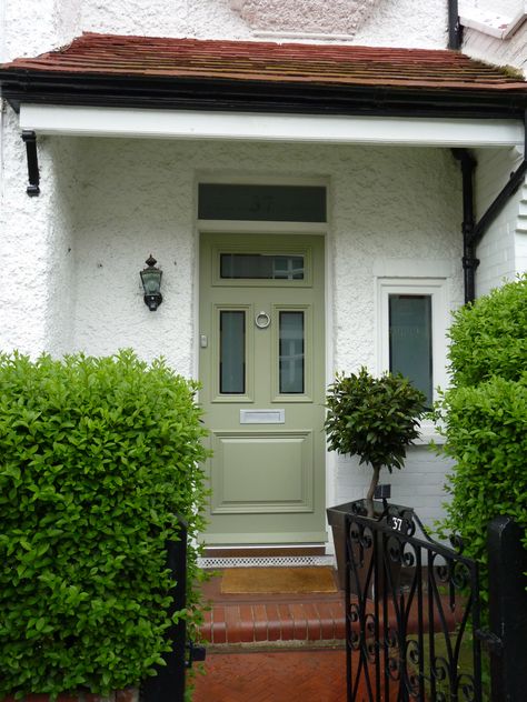 Olive green front door with chrome door furniture. Olive Green Front Door Colors, Olive Green Doors Exterior, Olive Green Front Door, Olive Front Door, Front Of House Makeover, White Storm Door, Front Door Apartment, Green Front Door, Victorian Front Doors