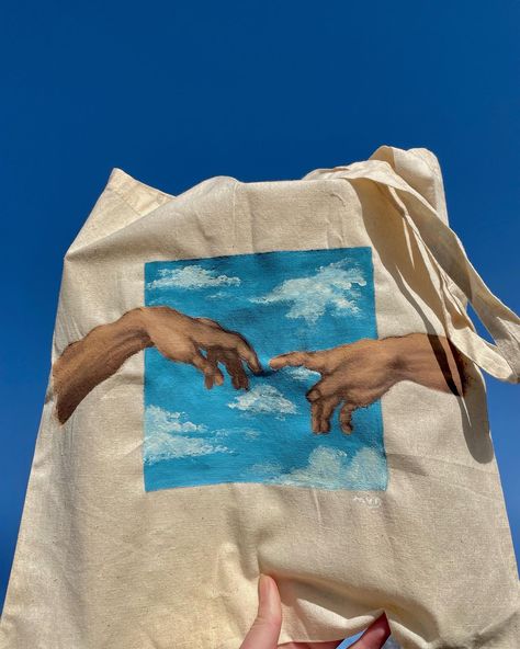 The song of Achilles  hands aesthetic paint tote bag Painting Ideas Tote Bag, Finger Touching Painting, Tote Bag Ideas Paint, Diy Painted Tote Bag, Hand Painted Tote Bags Art, Tote Bag Design Ideas Aesthetic, Tote Bag Painting Ideas Aesthetic, Painted Tote Bag Ideas, Michelangelo Hands