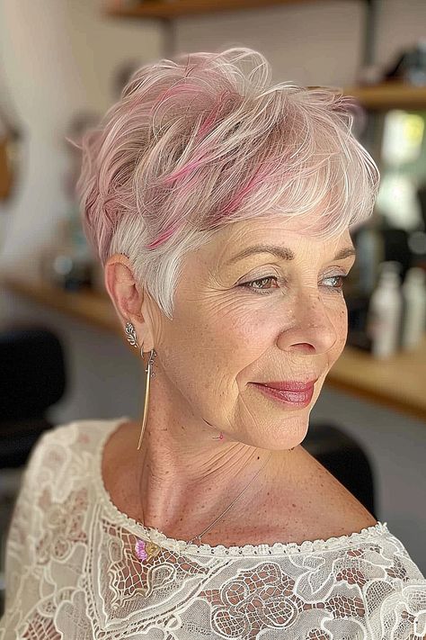 Romantic pixie cut with soft pink highlights for older women Blonde Pixie With Pink Highlights, Pink Pixie Haircut, Pink Pixie Hair, Soft Pink Highlights, Pink Pixie Cut, Layered Pixie Cut, Pink Pixie, Layered Pixie, Haircuts For Women Over 50