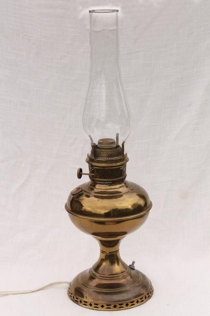 vintage brass lamp w/ glass chimney, old oil lamp converted to electric light Brass Oil Lamp, Electric Oil Lamp, Oil Lamp Converted To Electric, Diy Lantern Lights, Old Oil Lamp, Vintage Brass Lamp, Antique Oil Lamps, Magic Bottles, Diy Plant Hanger