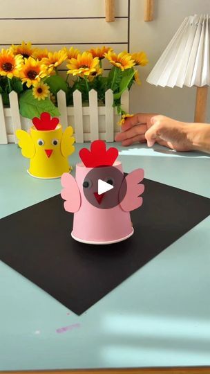 279K views · 33K reactions | Transforming a simple plastic cup into a rooster by adding fun details like wings, a beak, and that classic red comb on top is such a creative project! Using bottle caps as wheels and a hairband to store energy at the bottom of the cup adds a clever mechanical twist, making it an interactive and exciting craft. This is a fantastic parent-child activity that not only sparks creativity but also teaches basic mechanics in a fun and engaging way! Perfect for a weekend project full of learning and laughter! | Paper Craft Ideas Plastic Bottle Cap Crafts, Rooster Craft, Paper Cup Crafts, Basic Mechanics, Paper Craft Ideas, Cup Crafts, Weekend Projects, Bottle Caps, Fun Activities For Kids