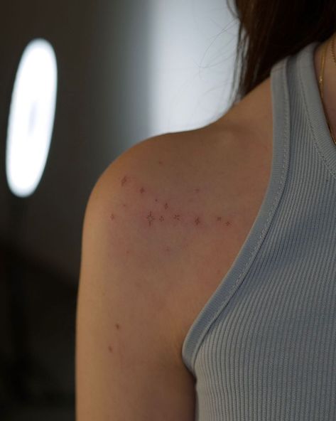 Small Stars On Shoulder Tattoo, Stars Tattoo Back Shoulder, Tiny Tattoos On Shoulder, Small Star Tattoos On Shoulder, December Constellation Tattoo, Brown Star Freckle Tattoo, Tiny Tattoos Shoulder, Tiny Stars Tattoo Shoulder, Shoulder Tiny Tattoo