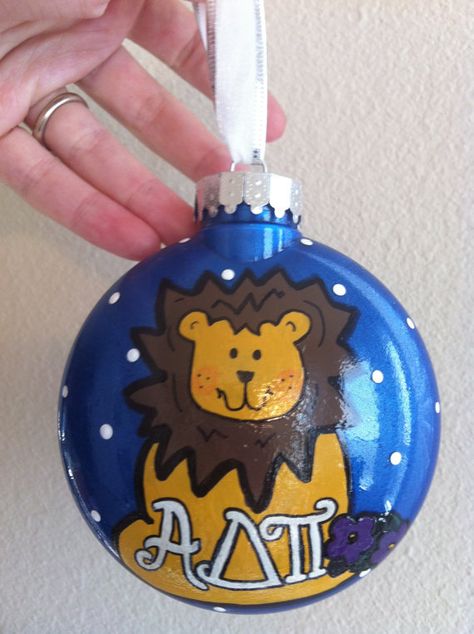 Adpi Letters, Lion Lamb, Alpha Delta Pi Sorority, Jesse Tree Ornaments, Lion Mascot, Jesse Tree, College Sorority, College Stuff, Hand Painted Christmas