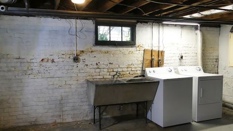 An old white washer and dryer sit next to a metal sink in front of a dirty white brick wall. Scary Basement, Basement Laundry Room Makeover, Dark Basement, Old Basement, Basement Redo, Basement Remodel Diy, Basement Laundry Room, Basement Laundry, Basement Inspiration