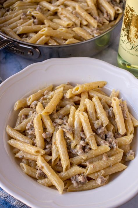 Pasta alla Norcina is an easy, creamy pasta dish originating from an Umbrian town famous for its pork products. Unsurprisingly, this comforting pasta features crumbled pork sausage and a generous amount of salty and delicious pecorino Romano cheese. Best of all, it takes less than 30 minutes to make! Creamy Pasta With Sausage, Pasta Alla Norcina, Garlic Herb Chicken, Pasta With Sausage, Creamy Pasta Dishes, Pecorino Romano Cheese, Pecorino Romano, Romano Cheese, Herb Chicken