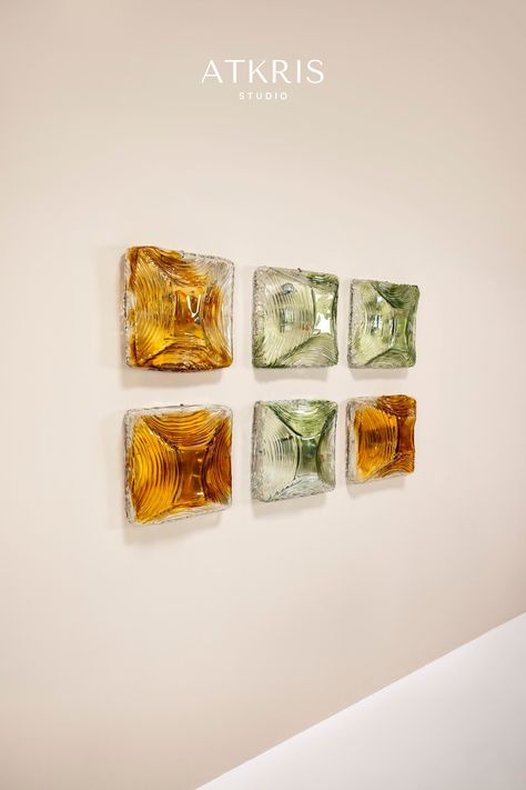 It's almost like having an exquisite set of jewels hanging on the wall. That is what this set of six wall lamps radiate. They are made from Murano glass and therefore have a distinctive appearance that is so characteristic of Italian hand-blown glassware. With the light sources off, this set is a pleasure to look at. green lamp | amber colored glass | Murano glass | wall sconces | wall lamps | vintage lighting | Italian design | 1970s design Murano Wall Light, Lamp Making, Lamps Vintage, 1970s Design, Green Lamp, Furniture Upholstery, Amber Color, Wall Lamps, Vintage Lighting