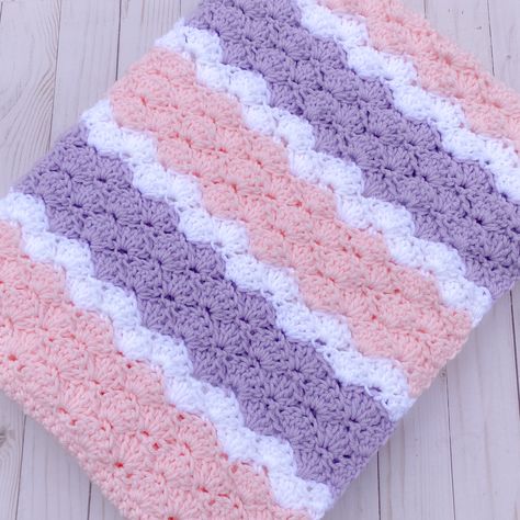 "This super soft, handmade pink and graylavender baby blanket is crocheted with a shell pattern and has a wonderful texture. It's the perfect afghan for your baby girl.  This blanket would also be an excellent newborn gift. *  30\" x 38\" *  Crocheted with high quality, super soft acrylic yarn *  Machine wash, cold water, gentle cycle.  Lay flat to dry. *  Handmade with love in a smoke-free, pet-free home. Check out a large selection of baby blankets in my shop:  https://www.etsy.com/shop/Kathie Crochet Baby Blanket Purple, Pink And Purple Crochet Blanket, Crochet Crib Blanket, Purple Afghan, Baby Mittens Pattern, Purple Baby Blanket, Blankets Crochet, Baby Afghan Crochet Patterns