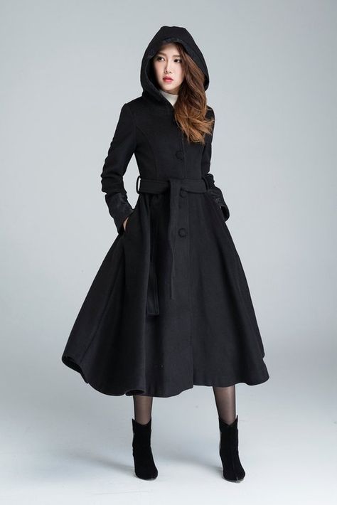 This classic black wool coat is made for the cold winter. In a fit and flare silhouette constructed from wool fabric with lace details around the sleeves hem, hood that keep you elegant. The long trench coat features buttons closure front, hood, lace-cuffed long sleeves + seam pockets at the Winter Coat Women, Hooded Coats, Hooded Wool Coat, Princess Coat, Black Wool Coat, Wool Trench Coat, Long Wool Coat, Long Trench, Long Trench Coat