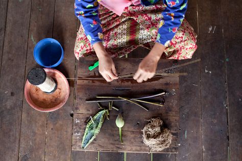 Lotus fiber extraction at a silk weaving factory in Inle Lake. Lotus Silk Fabric, Zine Layout, Lotus Silk, Floating Village, Lotus Fabric, Wooden Workshops, Straw Art, Inle Lake, Silk Weaving