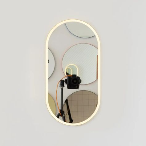 For Sale on 1stDibs - Modern handcrafted front illuminated capsule shaped mirror with an elegant brushed brass frame. Designed and handcrafted in London, UK. Fitted with a brass Pill Shaped Mirror, Extra Large Mirrors, Multiple Mirrors, Electrical Cable, Hollywood Mirror, Shaped Mirror, Illuminated Mirrors, French Cleat, Contemporary Mirror