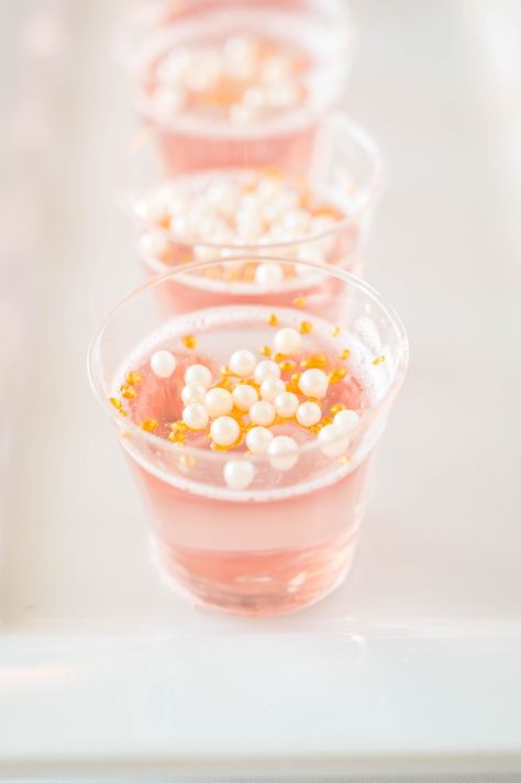 These Pink Champagne Jello Shots are made with pink champagne, white cranberry strawberry juice, water and gelatin. They are so easy to make on a whim for your New Year’s Eve parties and other celebrations! #jelloshots #champagnejelloshots #pinkchampagne Strawberry Champagne Jello Shots, Pink Champagne Jello Shots, New Years Jello Shots, Glitter Jello Shots, Pink Jello Shots, Boozy Candy, Champagne Jello Shots Recipe, Cotton Candy Glitter, Christmas Jello Shots