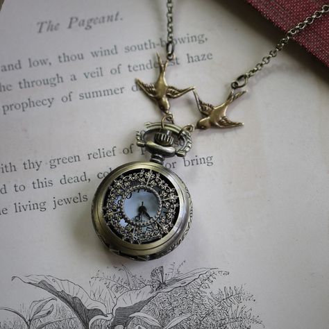 Small 25mm pocket watch necklace with a high quality quartz movement inside. On 28 inches of antiqued brass chain.  Available on a chain that has 2 little Victorian birds attached or on a simple chain with no birds. I can make this chain any length for no extra charge.  Just leave me a note at checkout! You can adjust the time by pulling up the knob and turning. Pressing the knob opens the watch. Each watch comes with an extra battery and printed watch care instructions. Steampunk Pocket Watch, Pocket Watch Necklace, Pocket Watches, Jewelry Inspo, Brass Chain, Watch Necklace, Battery Operated, Cute Jewelry, Quartz Movement