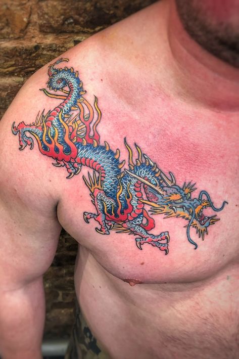 Boy Rigth Chest color dragon tattoo #dragontattoo #chesttattoo #mentattoo #tattoo #dragon #colortattoo Color Dragon Tattoo, Dragon Tattoo Full Sleeve, Traditional Tattoo Dragon, Dragon Tiger Tattoo, Geometric Heart Tattoo, Dragon Tattoo Shoulder, Dragon Tattoo Meaning, Red Dragon Tattoo, Dragon Tattoos For Men