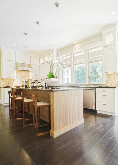 This kitchen has a very polished unique hardwood floor with touches of grey in it's hues. The dark coloring contrasts with the light island and walls. Dark Cabinets And Dark Floors, Light Floors Dark Cabinets, Kitchen With Dark Wood Floors, Dark Hardwood Floors Kitchen, Hardwood In Kitchen, Light Wood Kitchen, Dark Wood Floor, Backsplash For White Cabinets, Light Walls