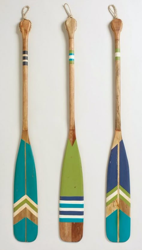 Decorative Oars for the Wall: http://www.completely-coastal.com/2016/03/decorative-oars.html Ad-oar-able oars, painted in all kinds of ways. Painted Oars, Paddle Decor, Deco Surf, Oar Decor, Painted Paddles, Don Pedro, Boat Oars, Canoe Paddle, Lake Decor