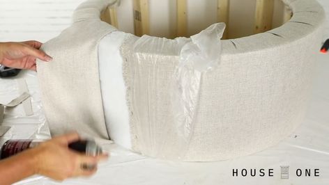 How to Make a Round Tufted Storage Ottoman | House One’s Jenn Largesse demonstrates how to build a #DIY round tufted ottoman without having to sew! | By This Old House | Hi, I'm Jen from House 1 and today, I'm showing how to make a round storage ottoman. At first glance, this project might seem very complicated but with a simple frame and the use of a staple gun instead of a sewing machine, it actually comes together much easier than you might think and I am not an upholster by any stretch of th Round Ottoman In Closet, How To Recover A Round Ottoman No Sew, Ottoman House, Round Tufted Storage Ottoman, Round Leather Storage Ottoman, Round Tuffed Ottoman, Round Tufted Ottoman, Kitchen Sewing, Round Storage Ottoman