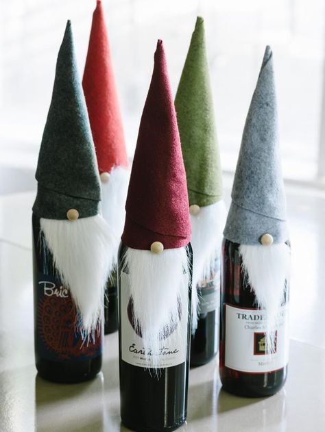 Tooo Cute! Homemade Christmas gift ideas from HGTV. Definitely need to check this out!   Elf Wine Bottle Covers - 8 Easy Handmade Holiday Gifts for Hosts on HGTV Joululahjat Diy, Gnome Hats, Holiday Hostess Gifts, Handmade Holiday Gifts, Wine Bottle Covers, Homemade Christmas Gifts, Wine Bottle Crafts, Tolu, Noel Christmas