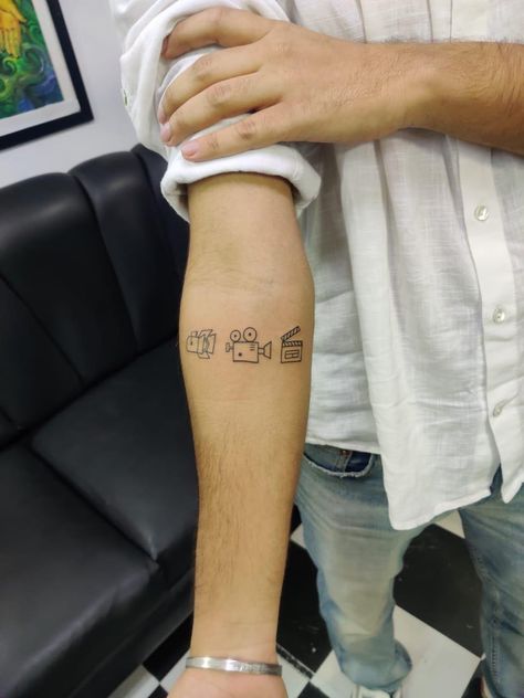 Film Tattoos Ideas, Film Clapper Tattoo, Small Tattoos Camera, Film Lover Tattoos, Video Editor Tattoo Ideas, Videography Tattoo Ideas, Lights Camera Action Tattoo, Small Film Tattoo, Film Camera Tattoo Small