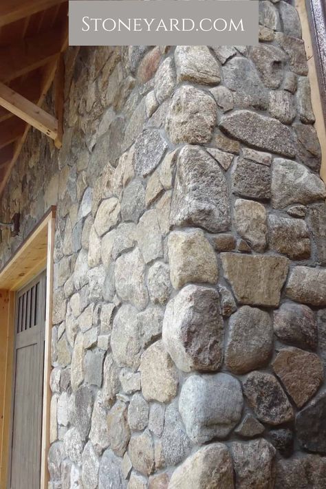 Our round stone veneer is the perfect product for your upscale home. Don't just trust us, look at this rustic stone and wood house exterior. Click here for more exterior ideas for your house. Wood And Stone Walls Interior Design, Stone And Shiplap House Exterior, River Stone Exterior Houses, Faux Stone House Exterior, Field Stone Exterior House, Diy Stone Exterior House, Mountain Stone House, Rock Wall House Exterior, Stone And Log Homes