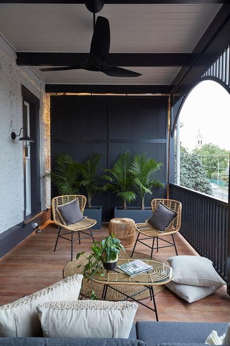 a modern terrace with black wooden slabs, wicker furniture, grey and neutral upholstery and potted greenery Ruang Tamu Outdoor, Balcon Mic, Ideas Terraza, Front Verandah, Balcony Design Ideas, Covered Balcony, Terrace Decor, Balkon Design, Small Balcony Design