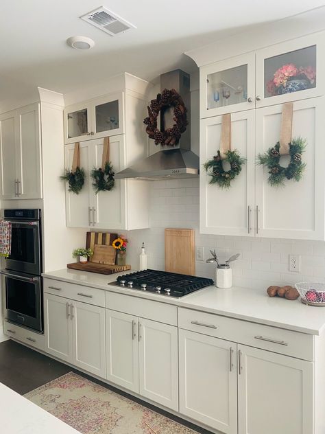 DIY Kitchen Cabinet Christmas Wreaths Christmas Wreaths Kitchen Cabinets, Christmas Wreath Kitchen Cabinets, Christmas Wreaths On Cabinet Doors, Kitchen Christmas Wreath, Wreath Kitchen Cabinet, Christmas Ribbon On Kitchen Cabinets, Christmas Wreaths On Kitchen Cabinets, Kitchen Cabinets Christmas Decor, Christmas Wreaths Hanging