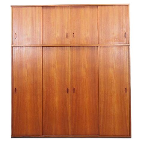 The wardrobe was made in the 1970s, Danish production.  The structure is covered with teak veneer. The handles are made of solid wood. The surface after refreshing. The inside space has been filled with five practical shelves without the possibility of height adjustment and a tube for clothes. The wardrobe has a practical solution of sliding doors, so that we reduce the need to leave a large free space in front of the furniture, while not restricting access to the interior of the furniture.  Con Midcentury Wardrobe Furniture, Teak Interior Doors, Mid Century Built In Wardrobe, Danish Wardrobe, Wardrobe Doors Ideas, Japanese Wardrobe, Teak Wardrobe, Wood Closet Doors, Modern Wardrobe Design