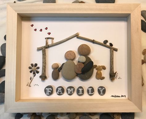 Pebble art, rock art, pebble family with parents and a couple of kids and their dog. All under a driftwood house. Rock Pictures Diy Pebble Art, Rock Family Art, Diy Pebble Art, Rock Pictures, Stone Pictures Pebble Art, Art Houses, Rock Family, Pebble Art Family, Pebble Pictures