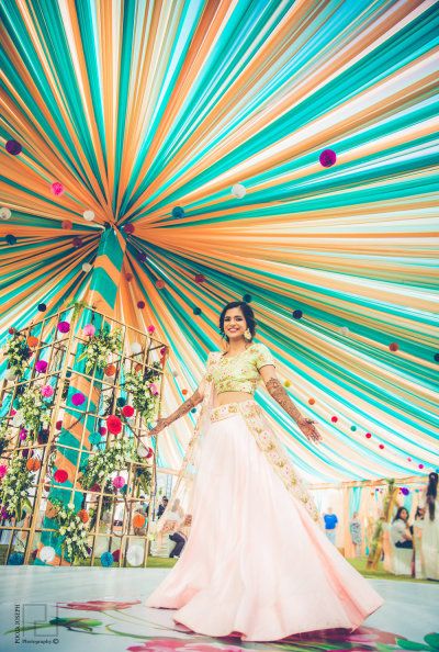 Light Lehengas - Pink Lehenga with Golden Detailing |  WedMeGood | Yellow and Blue Canopy with Floral Detailing  #wedmegood #weddingdecor #sangeetdecor #twirlingbride #floral #canopy India Party, Stage Backdrops, Wedding Tent Decorations, Mehendi Decor Ideas, Wedding Hall Decorations, Desi Wedding Decor, Marriage Decoration, Mehndi Decor, Beautiful Wedding Decorations