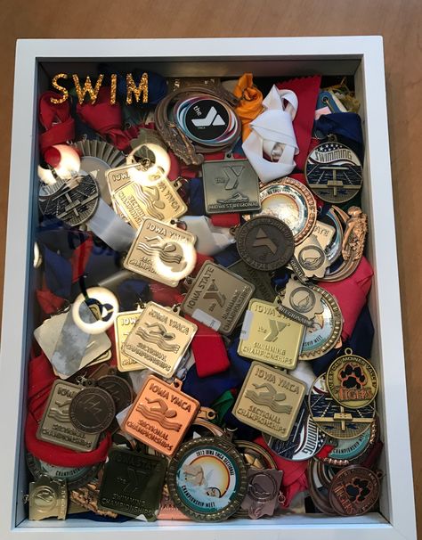 My daughters swimming medals displayed in a shadow box for her high school graduation party Swimming Medal Display Ideas, School Medals Aesthetic, Sports Medal Display, Medals Display, Gymnastics Medals, Girl Graduation Party, Swimming Medals, Trophy Display, Senior Graduation Party