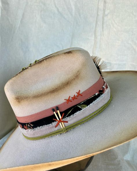 “Cow Belle” Custom burned and banded silver belly cowboy hat adorned with hand sewn details, matches, leather, silver concho, multiple fabrics and turkey feathers. Very good quality cashmere wool felt hat. One of a kind. Size: 7 $275 https://theroguecowpoke.etsy.com/listing/1807938475 Turkey Feathers, Felt Hat, Hats For Sale, Leather Silver, Cashmere Wool, Cowboy Hat, Custom Hats, Hand Sewn, Wool Felt