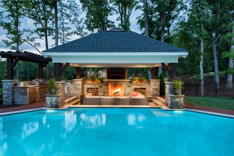 Pool cabana with custom fireplace and wood storage boxes. Including an outdoor kitchen with trellis featuring Bull Outdoor Products. #outdoorliving #cabana #customefireplace #outdoorkitchen Backyard Pool Cabana, Pool Cabana Ideas, Pool House Cabana, Pool Patio Designs, Outdoor Pavillion, Gazebo Design, Pool Gazebo, Pool Pergola, Pool Design Ideas