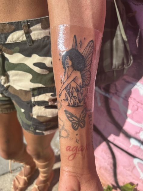 Mermaid Tattoos Black Women, Mermaid Tattoo Black Woman, Black Fairy Tattoo Designs, Fairy Tattoos Black Women, Black Barbie Tattoo, Tramp Stamps Black Women, Fairy Tattoo Designs Black Women, Ethereal Tattoos Black Women, Fairy Tattoo With Curly Hair