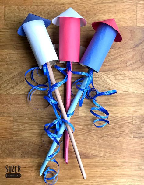 Get fired up about the fourth of July with a paper firework decoration made from toilet paper tubes, construction paper and ribbon | suzerspace.com Firework Costume Diy, Rocket Activities, Bonfire Party Decorations, Super Easy Crafts, Firework Party, Bonfire Night Crafts, Cheer Crafts, Fireworks Craft For Kids, How To Make Fireworks