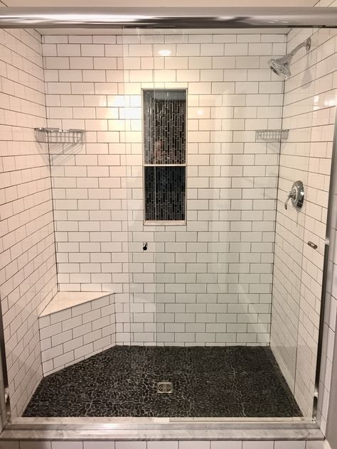 Master shower - Subway tile with grey grout, vertical backsplash niche and sliced pebble tile floor. Pebble Shower Floor, Patterned Bathroom Tiles, Tile Colors, Subway Tile Showers, Pebble Floor, Creative Bathroom, Master Shower, White Subway Tile, Shower Remodel